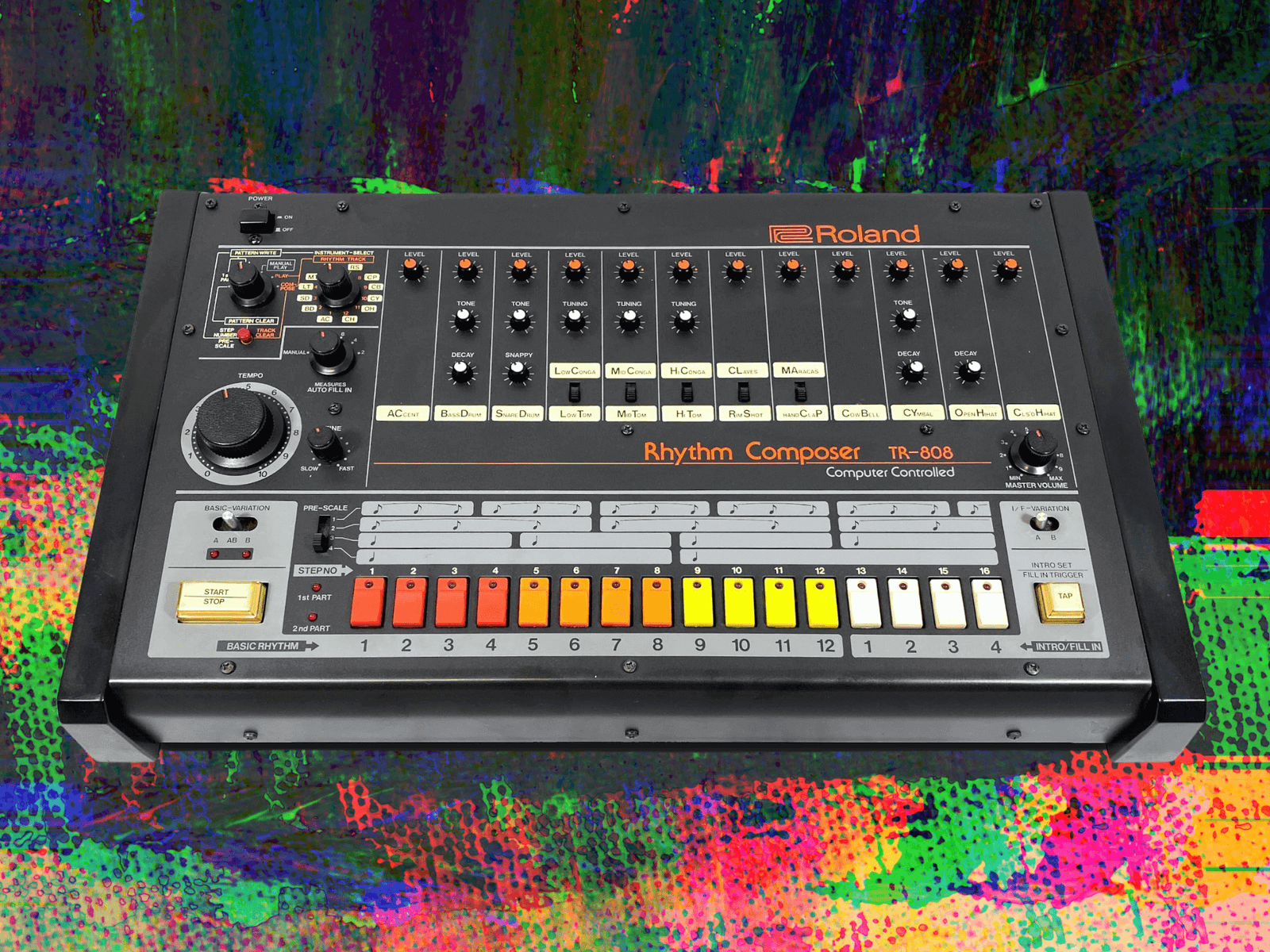 a roland 808 drum machine on a colorful background