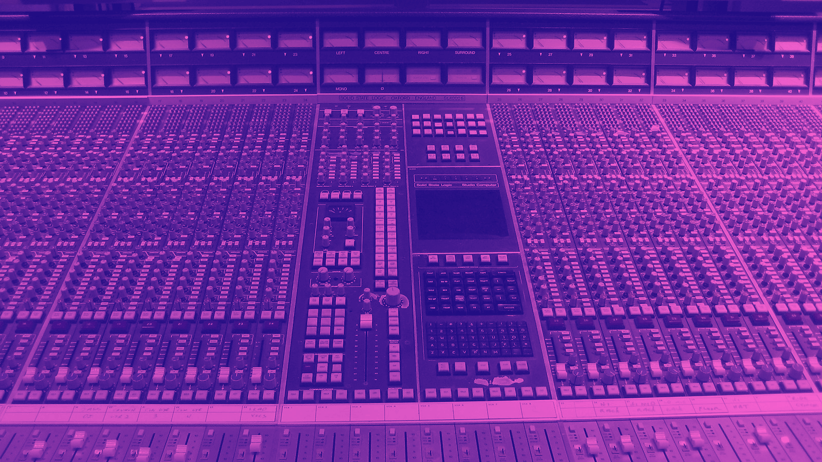 a large format mixer in a recording studio