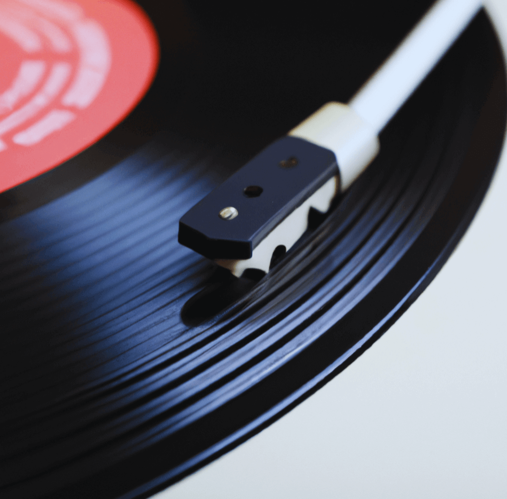 a stylus from a record player on a vinyl record